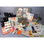 Collectables including a quantity of old matchbox labels, a group of 20th century camera lenses,