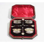 A set of four Victorian silver salts, each of shaped circular form, with embossed decoration,