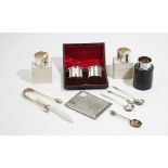 Silver and silver mounted wares, comprising: a rectangular cigarette case, a pair of napkin rings,