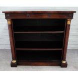 A Regency rosewood floor standing open bookcase, with gold painted turned columns,