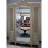 A Louis XVI style white painted wardrobe, 21st century, with foliate carved ornament,
