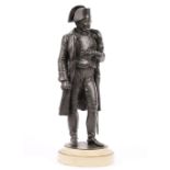 A patinated bronze figure of Napoleon Bonaparte, circa 1900, raised on a circular plinth, 32cm high,