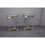 A pair of modern mirror veneered circular occasional tables, on tapering square supports,