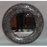 A modern circular glass and resin framed wall mirror, 96cm diameter.
