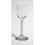 A wine glass, circa 1760, the bell bowl raised on a mixed twist stem and plain foot, 14.75cm. high.