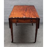 A George III coromandel banded mahogany Pembroke table, on tapering square supports,