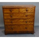 A Victorian mahogany chest of two short and three long graduated drawers, on turned supports,