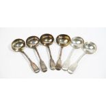 Six silver fiddle pattern sauce ladles, comprising: a pair London 1824, a pair London 1827,