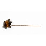 A late Victorian gold and silver set tiger's eye and diamond stick pin, designed as a tortoise,
