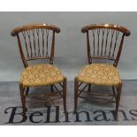 A pair of late 19th century stained beech lattice back occasional chairs on splayed supports,