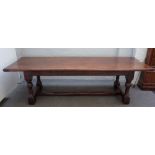 A 17th century style oak refectory table, the cleated plank top on baluster turned supports,