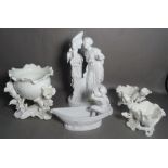 A group of white glaze porcelain, including large porcelain figure group of a lady,