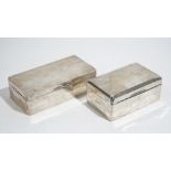 A silver rectangular table cigarette box, the hinged lid engine turned, wooden lined within,