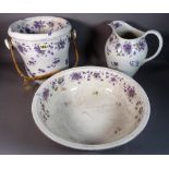 An early 20th century ceramic wash set comprising a jug and bowl and slop bucket,