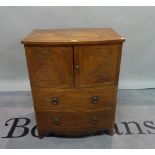 A Regency mahogany bowfront commode chest, with two short drawers on splayed bracket feet,