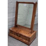 A George II figured and featherbanded walnut toilet mirror, with a three drawer base,
