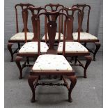 A set of six 19th century walnut vase back dining chairs, of Queen Anne design on pad feet, (6).
