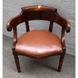 An early 20th century French oak framed tub back office chair, on reeded supports,