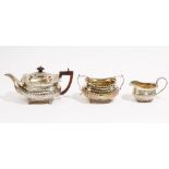 Silver tea wares, comprising; a teapot decorated with slanting fluted decoration,