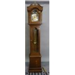 A modern oak longcase clock, one pendulum, three weights, 41cm wide x 209cm high.