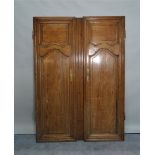 A set of early 20th century stained pine doors, with moulded panel decoration,