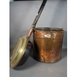 A late Victorian copper bucket, 34cm diameter x 32cm high, and a copper warming pan, (2).
