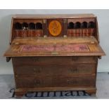 A mid-18th century mahogany bureau with fitted interior and ogee bracket feet,