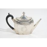 A George III silver teapot, of oval panelled form, with engraved decoration, tapered straight spout,