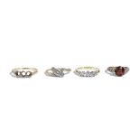 A gold and platinum, diamond set three stone ring,