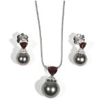 A white gold, garnet, black cultured pearl and diamond-set necklace and earring suite by Autore,