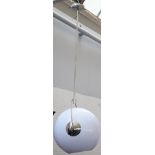 A set of three large chrome hanging lights,