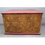 A Thai painted and gilded chest, with hinged top, the front and sides with panels of deities,