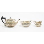 A late Victorian silver three piece tea set, by Elkington & Co. Ltd.