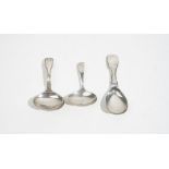 Silver caddy spoons comprising; a single struck fiddle, thread and shell pattern caddy spoon,