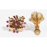 A ruby and diamond-set single earclip Of flowerhead design;