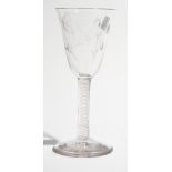 A Jacobite type wine glass, circa 1765, the rounded funnel bowl engraved with two roses and buds,