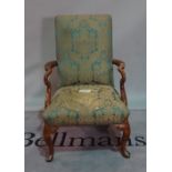A late George III style mahogany framed open armchair, on cabriole supports, 74cm wide x 109cm high.