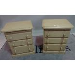 A pair of modern green painted bedside tables, each with brushing slide over three long drawers,
