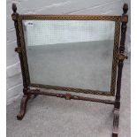 A Regency brass inlaid swing frame toilet mirror on spiral turned supports, 63cm wide x 68cm high.