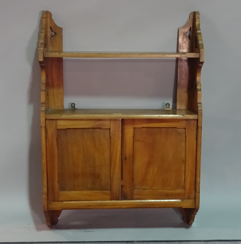 A 19th century Gothic revival two door hanging wall cupboard, 62cm wide.