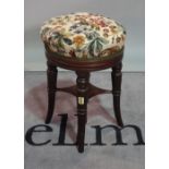 A Victorian rosewood piano stool, 35cm diameter x 51cm high.