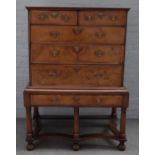 An early 18th century crossbanded walnut chest on stand,