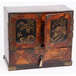 An early 20th century Japanese lacquer and specimen wood table cabinet,