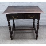 A 17th century oak single drawer side table, on barley twist supports, 87cm wide x 76cm high.