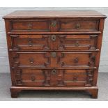A Charles II oak chest, of four long geometric drawers, 104cm wide x 97cm high.
