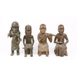 Four African patinated bronze figures, 20th century, two playing musical instruments, 34cm high (4).