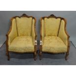 A pair of early 20th century beech framed tub chairs on cabriole supports, 61cm wide x 90cm high,