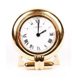 A Cartier 'colisee' quartz travel alarm clock, circa 1998, white dial with Roman numerals,