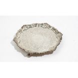 A silver salver of shaped rectangular form,