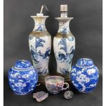 A pair of Chinese crackleglaze blue and white vases, painted with figures scenes, 30cm high,